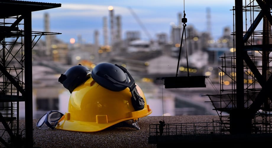 Double exposure of Standard construction safety and construction site background. Double exposure of Standard construction safety and construction site background.